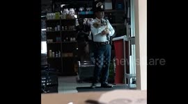 Security guard  helps troubled puppy to sleep