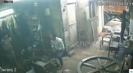 CCTV moment a worker's phone explodes in his pocket leaving him with burns and smoking trousers