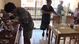 Chinese Tourists Eat Breakfast In Matching Elephant Shirts