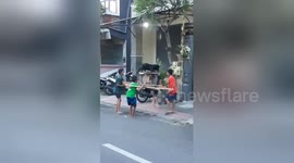 Indonesian kids parade dog at religious festival