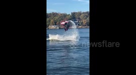 Jet skier makes a splash with a double flip during stunt jump attempt