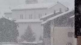 Dense snow nearly whites out northern Italy town