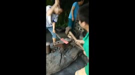 Two blacksmiths are demonstrating skills of using the hammer to forge knives