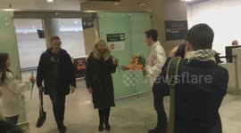 Women gifted with flowers at St. Petersburg airport to mark International Women's Day