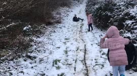 Man gets taken down by son sledding downhill