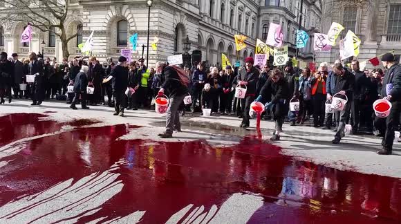 Climate activists throw 'blood' outside Downing Street