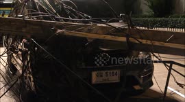 Driver has lucky escape after electricity post falls on his car