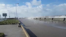 Waves batter new brighton in 50 mph winds road closed off