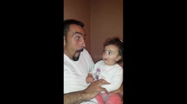 Dad and baby daughter trade funny faces in this utterly adorable clip