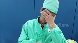 An overworked engineer falls asleep at his desk.