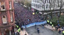 Wall of Schalke fans march through Manchester city centre