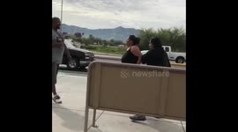Only In Phoenix: Woman almost starts a fight while a man balances bottles on his head nearby