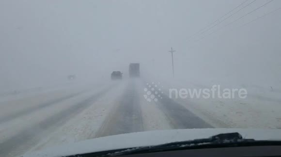 Massive trucks nearly collide during intense Denver blizzard
