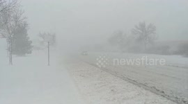 Traffic slow in blizzard