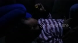 a girl in the field eats cake to sleep on car