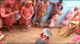 Women beat men with sticks during traditional north Indian festival