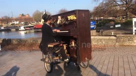 Busker shows off his incredible bicycle-piano contraption