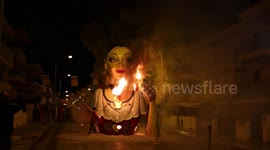 Spanish town burns massive head sculpture in fiery festival finale