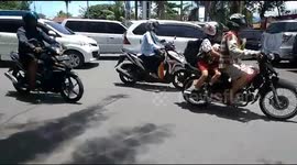 a number of cars were parked at the roundabout of the main road in Padang city, Indonesia