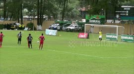 Footballer celebrations goal by climbing ladder to change the scoreboard himself