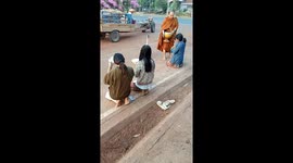 Adorable moment duck joins Buddhist monk on his morning walk