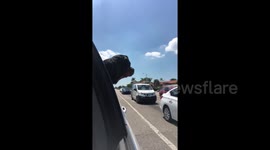 Oskar the Safety Boy is warning everyone to clear the road bc an ambulance needs to get through.