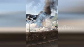 Workers clash with French riot police in Le Mans city centre