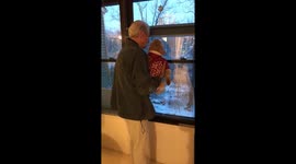 When your parents realise this is the closest they'll get to grandchildren! Man shows his grand-dog deer in the garden