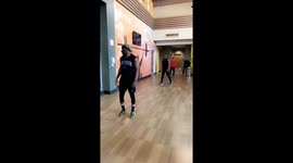 Man jumping over adult