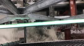 View from New Zealand bridge moments before it is washed away by river