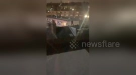 Two man escaping  on the rooftops in Kilburn