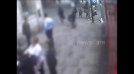 Police are hunting a woman who could have killed another after a minor row by shoving her so hard she ended up in the path of an oncoming bus