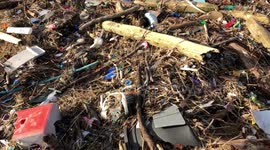 Walking over marine pollution on a beach in Scotland