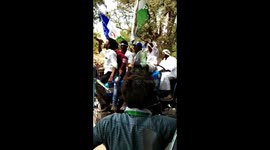 Men drinking on tractor while canvassing for prohibition candidate in India