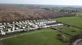 Shocking aerial pictures show scale of devastation after huge blaze tore through holiday park destroying 40 caravans