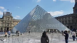 Art installation leaves pyramid entrance to Paris' world-famous Louvre museum trashed