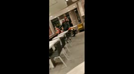 Man enters McDonalds building with motorcycle