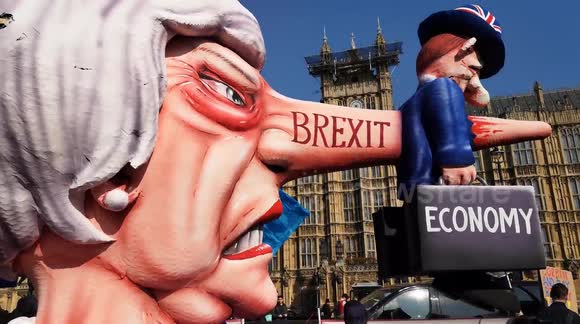 Anti-Brexit protesters bring long-nosed Theresa May back to Westminster