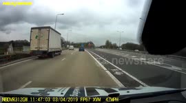 Car in wrong lane on motorway, nearly causes an accident.