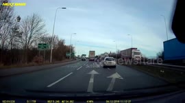 Car sideswiped by HGV attempting to turn right wrong way around roundabout