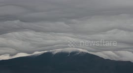 Bizarre 'sheet-like' clouds seen rolling over Mount Etna