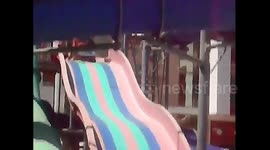 Woman on a slide  gets more than she bargains for