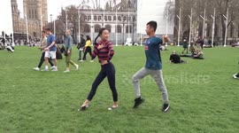 Dancing pair in Parliament Square on a Saturday afternoon