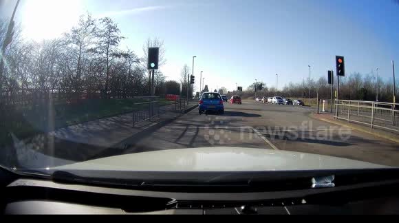 Near Miss Car runs red light by going straight ahead in right turn only lane