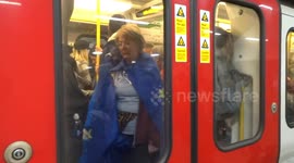 EU supporter boards the train at Victoria station after the Peoples Vote rally on 23 March 2019