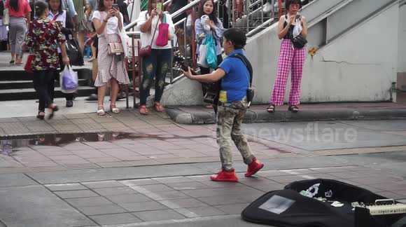 Street musicians of Thailand - the little guitarist in red red shoes 2