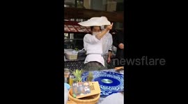 Kung fu master shows off Tai Chi moves while spinning roti pirata dough