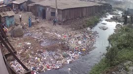 Locals dumping plastic garbage into stream in Kenyan capital
