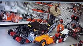 Shocking moment US man steals chainsaw by sticking it down his pants