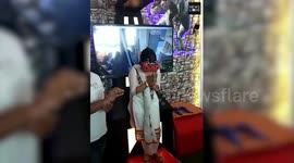 Woman screams while playing game wearing VR glasses